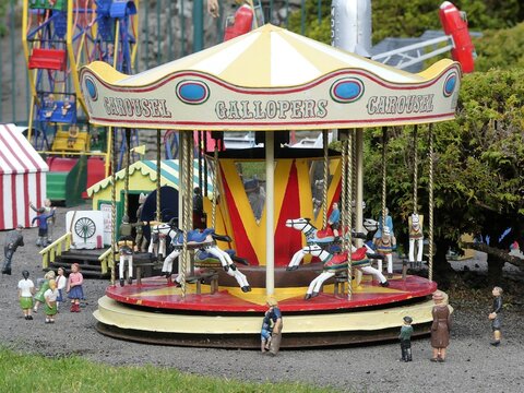 Miniature fairground carousel at Bekonscot Model Village in Beaconsfield, Buckinghamshire