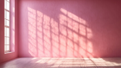 Empty space in pink tones, featuring a captivating play of light and shadow on the wall and floor. 