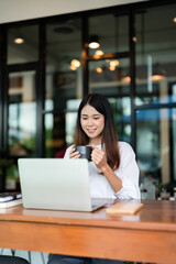 Writer woman thinking creative ideas for business data content and drinking coffee beverage in cafe