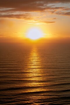 Vertical shot of a tranquil sea at beautiful sunset