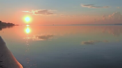 sunrise over a calm bay
