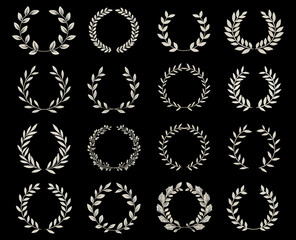 Obraz premium a wreath made from flowers and leaves on black background