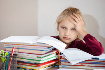 Homework Difficulty. Stressed Sad Tired Schoolchild Needs Help with Homework in Elementary School. - obrazy, fototapety, plakaty