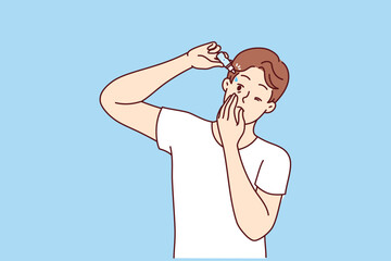 Man drips moisturizing liquid into eyes to improve vision or avoid drying out of retina. Guy uses eyes drops prescribed by ophthalmologist recommends preventive measures to combat blindness.