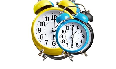 Vintage alarm clock on the white background