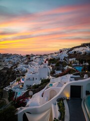 Vertical shot of the beautiful sunset over the resorts in Santorini, Greece