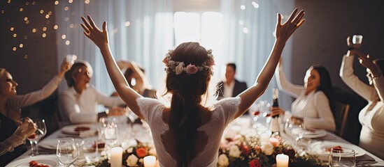 The woman with a creative design background expertly arranged the white table at the wedding party adorned with elegant decorations and glasses of wine creating a stunning atmosphere of lov
