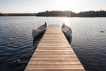 dock and canoes on the lake