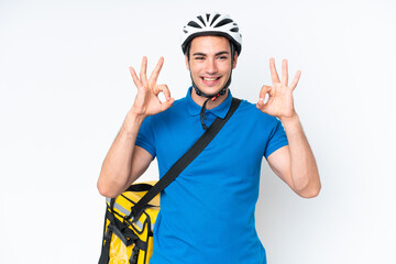 Young caucasian man with thermal backpack isolated on white background in zen pose