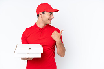 Pizza delivery caucasian man with work uniform picking up pizza boxes isolated on white background...