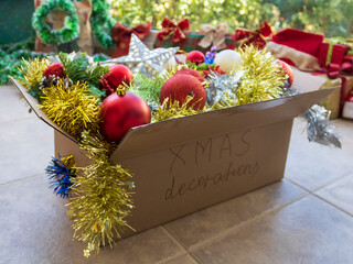 Carton box full of Christmas decorations 