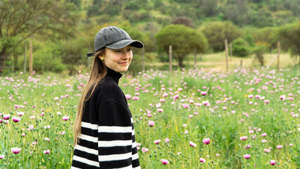 Joyful and content young woman in the countryside.