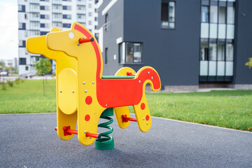 A horse on a spring on the playground
