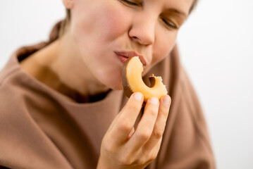 Decadent delight: An attractive woman in her prime relishing the sinful pleasure of a...