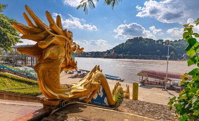 Golden Dragon with wide open mouth wrapped down the Stairs at the Golden Triangle on the Laos Side...