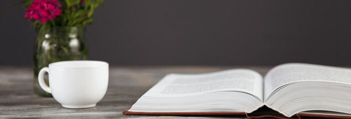 Holy Bible with coffee and flower