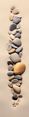 Fototapeta na wymiar Panoramic view of a line of stones embedded in the sandy shoreline, creating a tranquil and visually captivating scene.