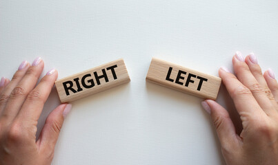 Right or Left symbol. Concept word Right or Left on wooden blocks. Businessman hand. Beautiful white background. Business and Right or Left concept. Copy space