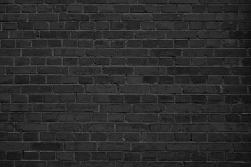 Old black grunge background. Brick wall tetxure