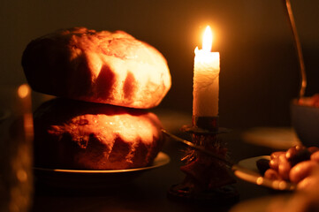 Christmas Eve in a Ukrainian family. Kutia on the table and a lighted candle.