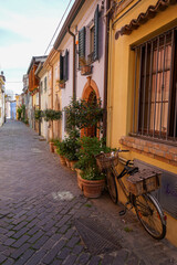 Picturesque mediterranean italian alley in rimini. colorful houses in the town 