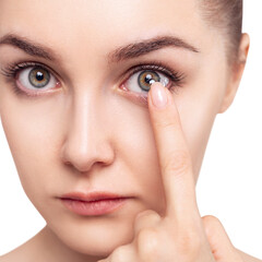 Fototapeta premium Young woman wearing contact lenses.