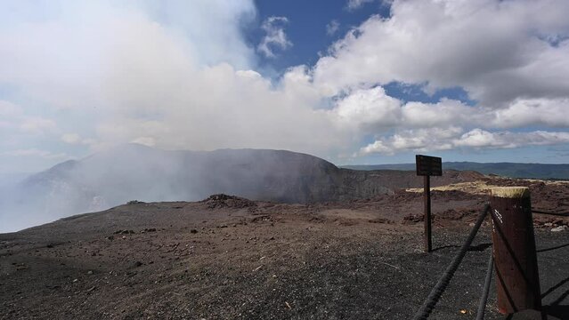 Masaya volcano national park in Nicaragua with smoke coming in rock valley