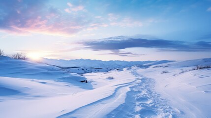 Snowy peaceful winter landscape with clouds over the snow