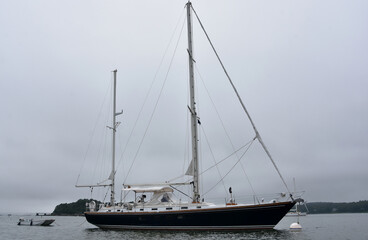 Large Luxury Sailboat Anchored in a Harbor