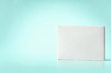 Blank white flat box on blue background with copy space