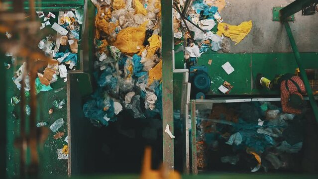 City Waste Sorting Facility Conveyors and a Worker