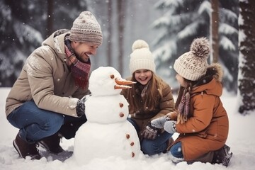 Happy father, mother and kids gathering in snow-covered park together sculpting funny snowman from snow. Parents and children playing outdoor in winter forest. Family active holiday comeliness - obrazy, fototapety, plakaty