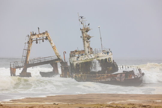Shipwreck Zeila in the crashing waves near Swakopmund on Namibia Skeleton Coast