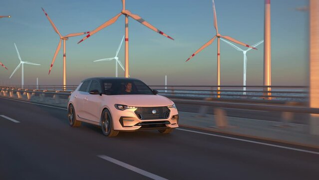 Generic electric car driving along bridge or coastal highway into the sunset. Offshore wind turbines building up behind. Expansion of renewable energies. Wind farm construction. Green energy concept