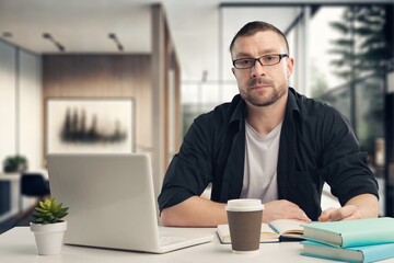 Fototapeta na wymiar Business man works on laptop, planning a finance