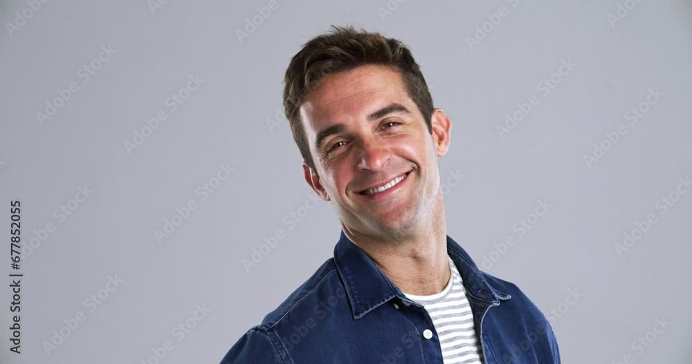 Poster face, smile and a confident young man in studio isolated on gray background to relax while feeling p