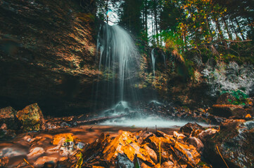 waterfall in autumn forest