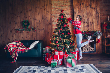 Full body length photo of cheerful young girl model decor christmas tree preparing party stack...