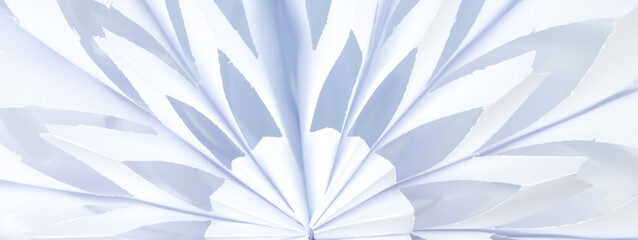 Snowflake made of paper on white background. voluminous. panorama, banner.