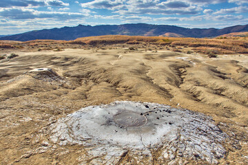 cones of mud volcanoes from which rivers of mud flow
