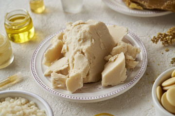 Raw unrefined shea butter or karite with other ingredients for homemade cosmetics