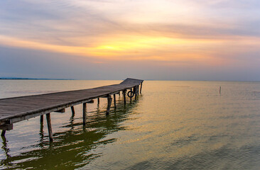 Fototapeta na wymiar pontoon at sunrise on the lake
