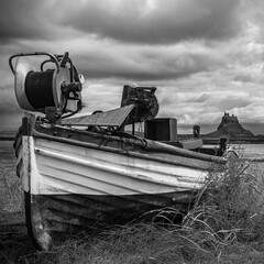 Closeup shot of a boat on Lindisfarne (Holy Island), England in grayscale