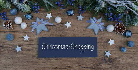 Sign with Christmas decorations and the text Christmas Shopping.