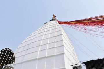 Fototapeta premium Low angle shot of a white building with red ribbons
