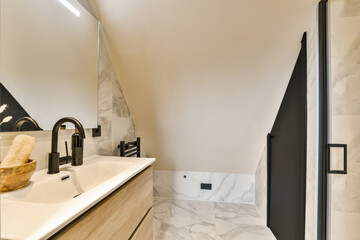 a modern bathroom with marble counter tops and black trim around the shower door, while it is white in color