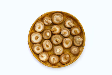 Fresh shiitake mushrooms on white background.