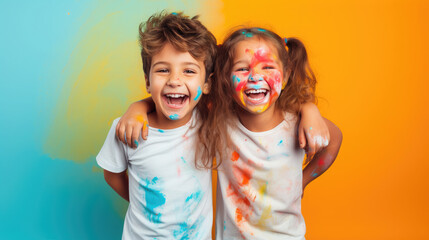 cheerful children, boy and girl on a colored background in the studio, brother and sister, child, kid, toddler, childhood, portrait, face, emotional, expression, joy, friends, happiness, baby, clothes