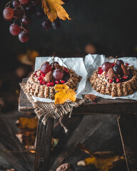 Healthy Tarts Granola Tartlets with Nuts, Chocolate, pomegranate and Grapes