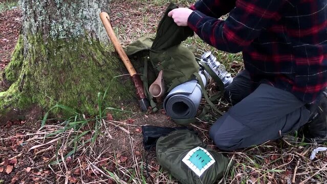 Hiker in a forest, bushcraft and camping
